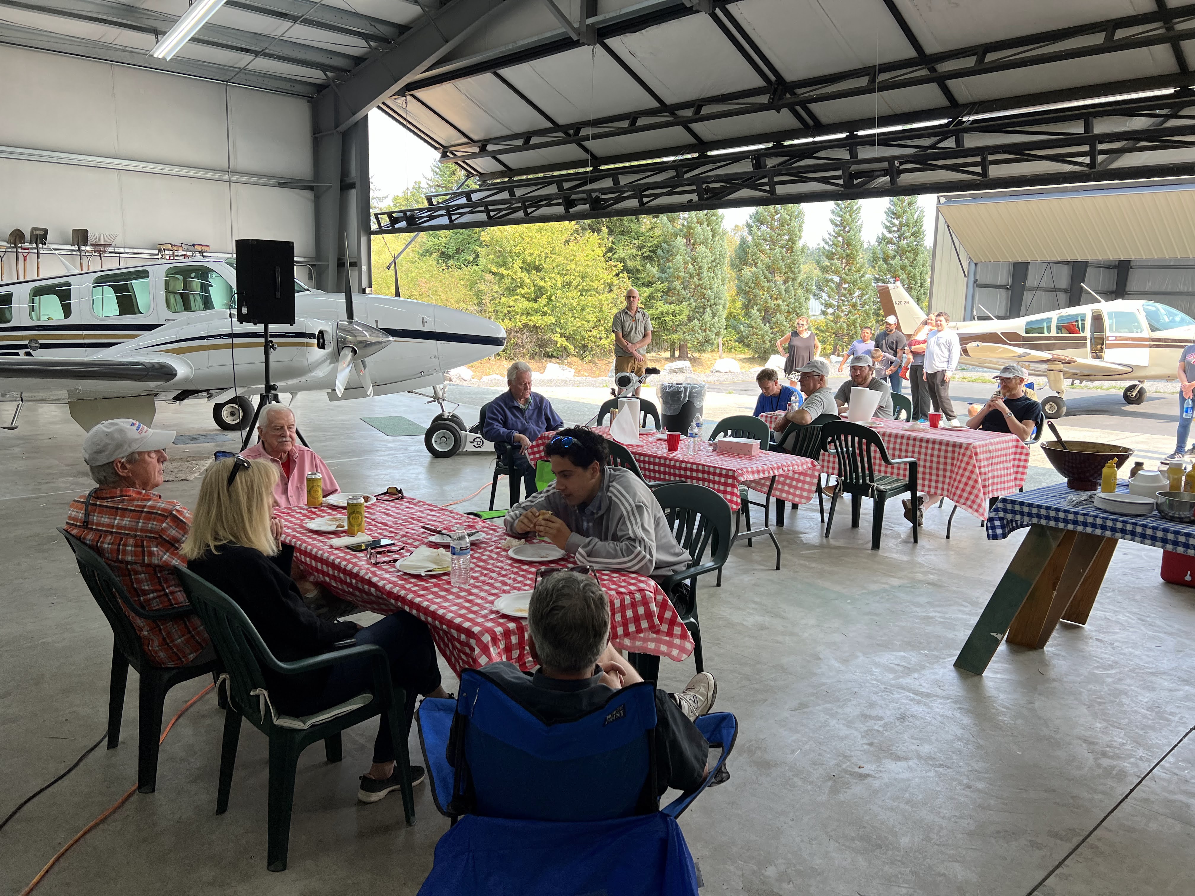 Club members gathered for the annual summer barbecue in the hangar