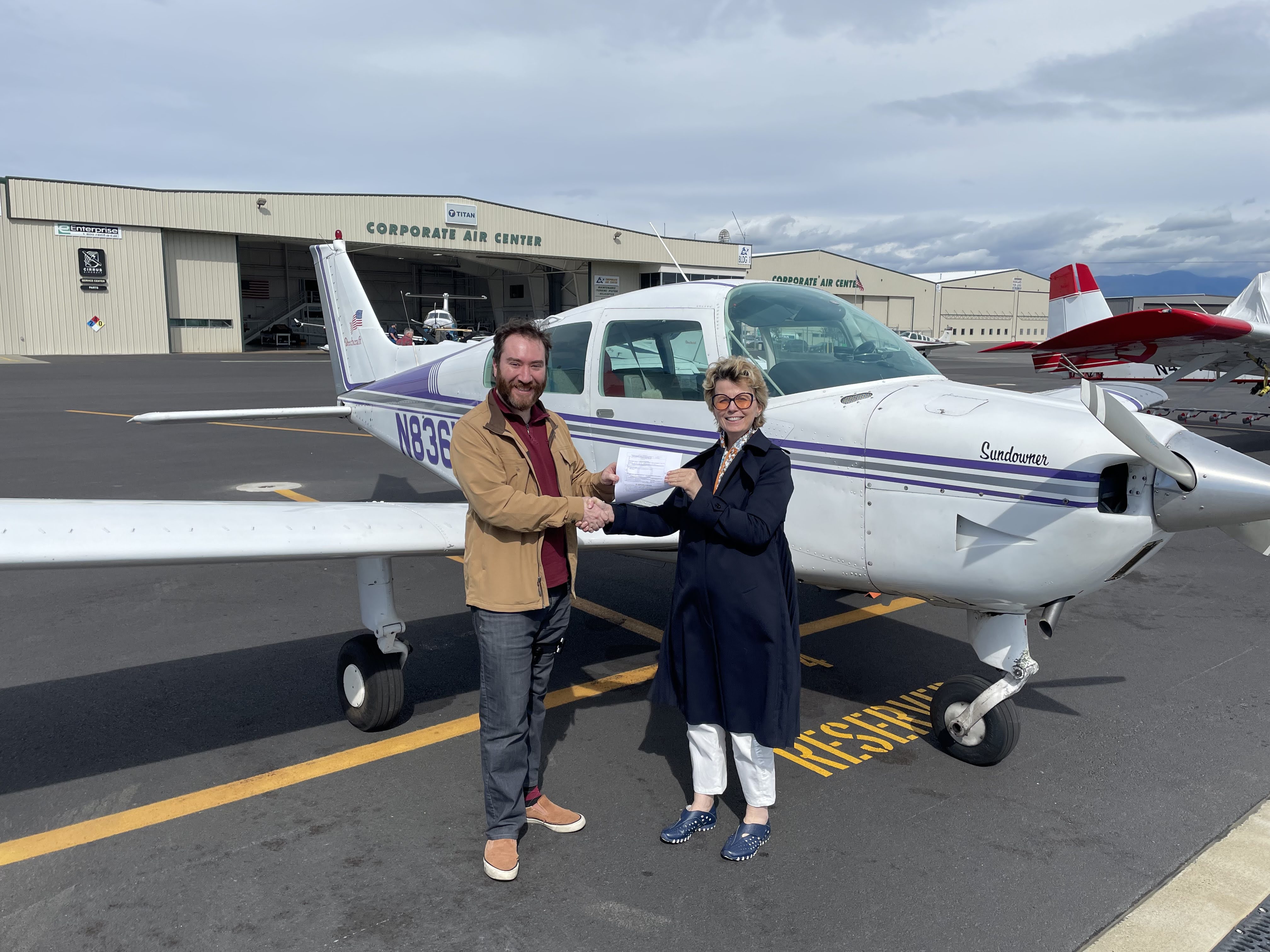 N836KT Katie, a purple-striped Beechcraft Sundowner
